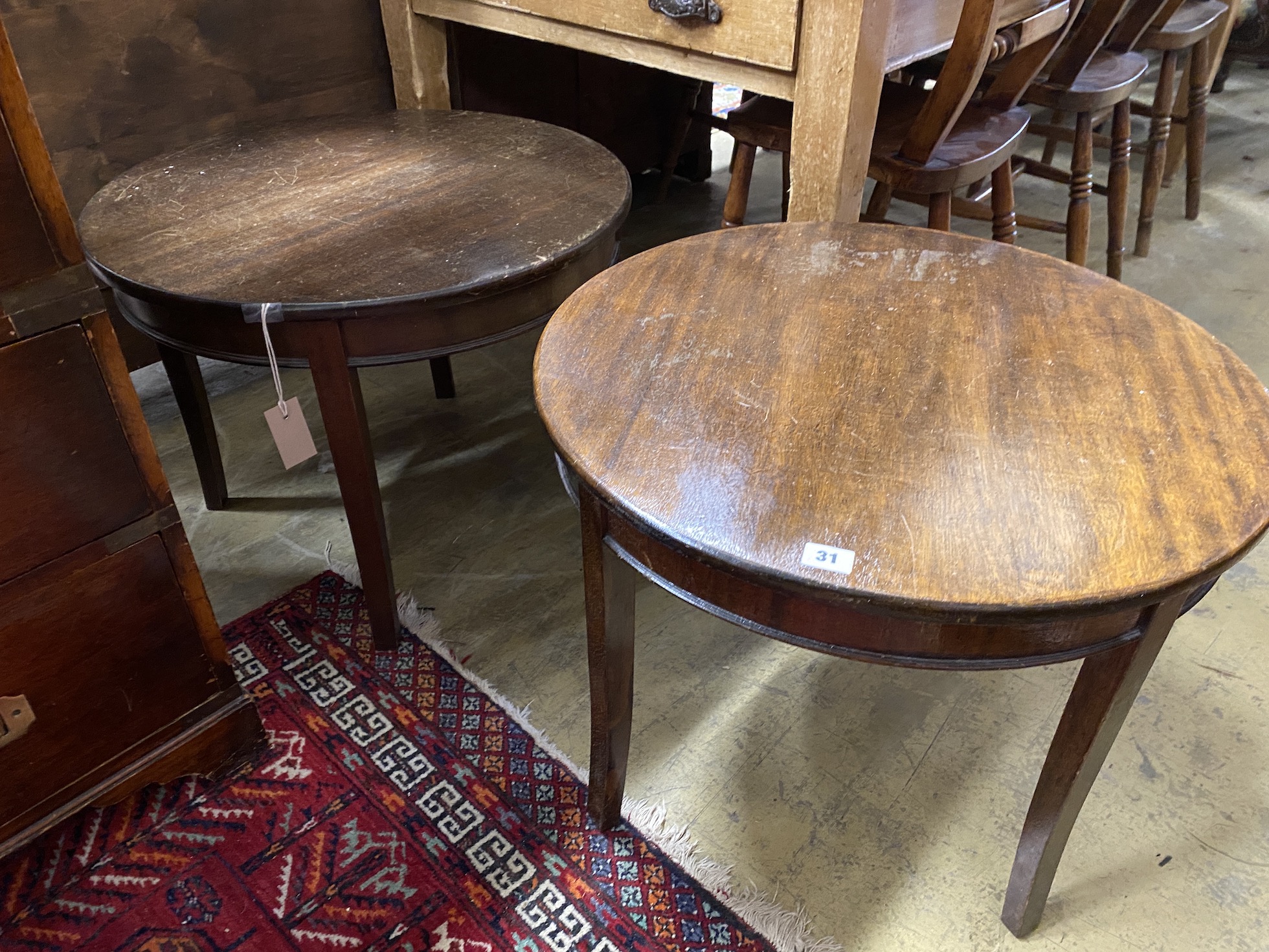 A pair of circular mahogany and beech occasional tables, diameter 61cm, height 46cm